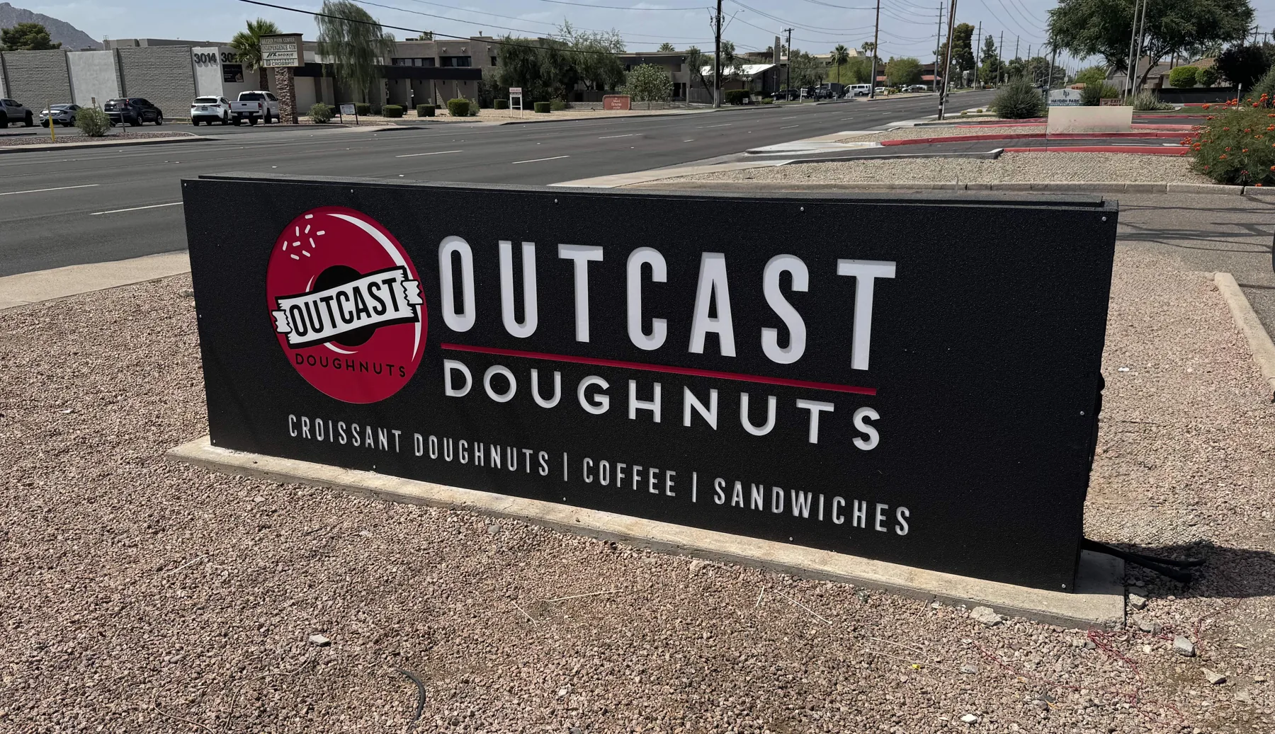 Outcast Doughnuts monument sign